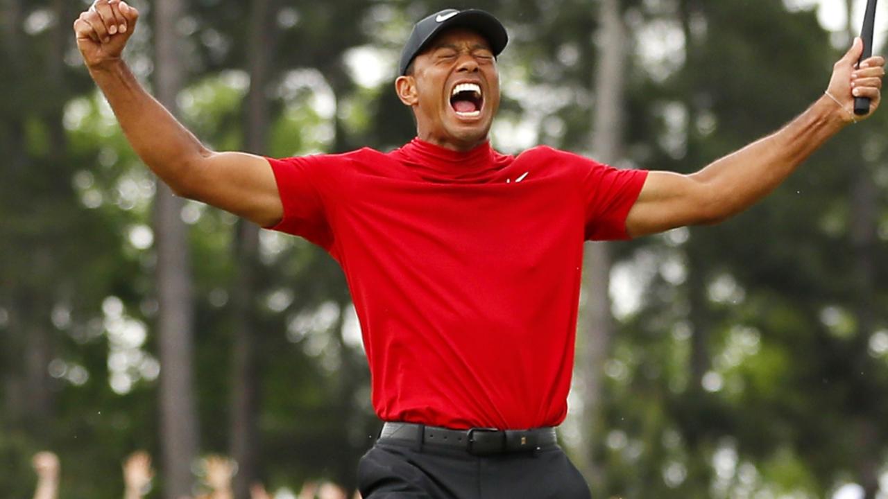Tiger Woods celebrates winning the Masters last year. (Photo by Kevin C. Cox/Getty Images)