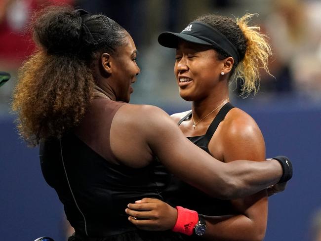 Serena Williams and Naomi Osaka meet at the net. (Photo by Eduardo MUNOZ ALVAREZ / AFP)