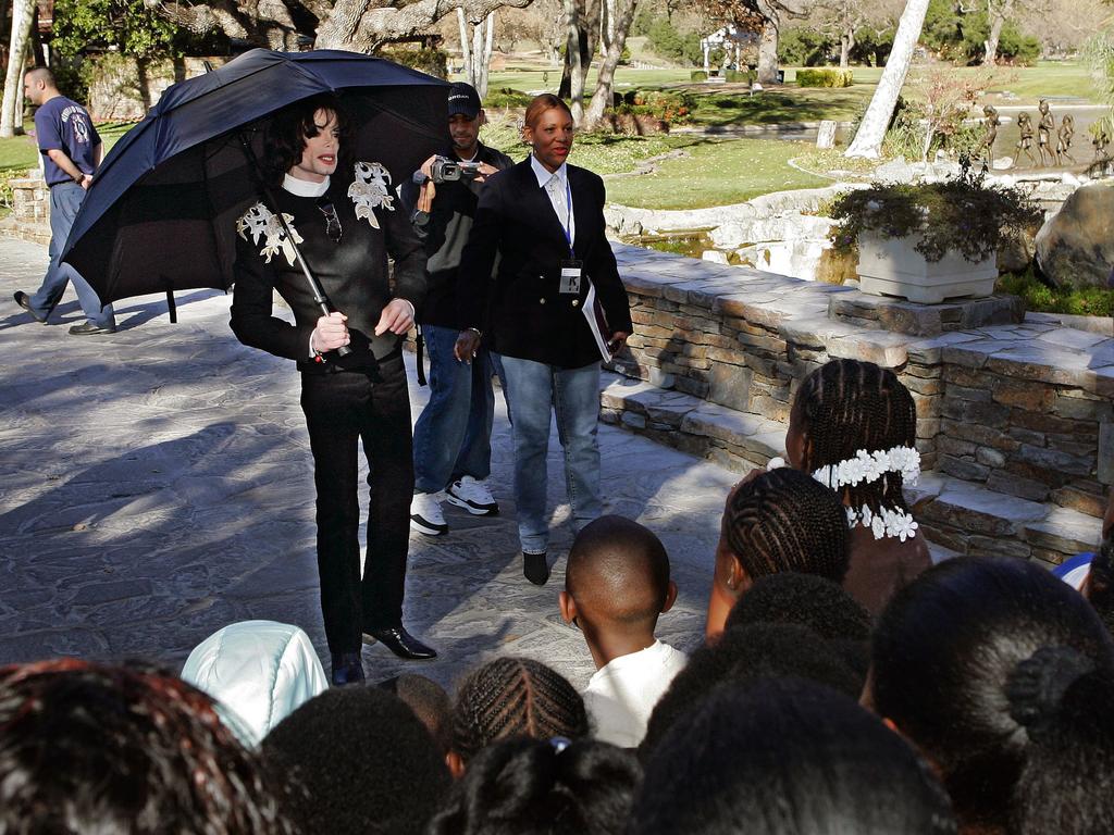 Jackson greeting several hundred children that were invited guests at his Neverland Ranch in 2004. Picture: AP