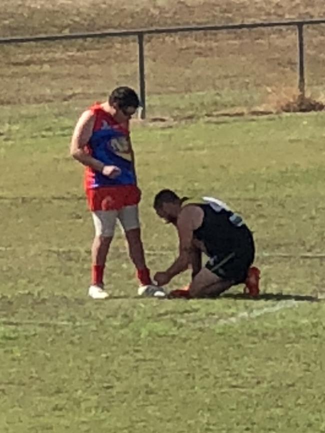 Tiger Scott O’Donnell helps with his opponent's shoelaces.