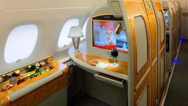 First class seats come complete with a private minibar.