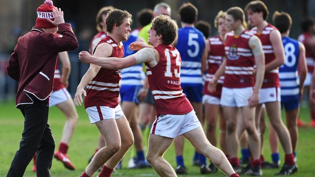 Jamison Murphy (pictured in footy gear on left) is pursuing footy and stepping away from cricket. Picture: AAP/Mark Brake