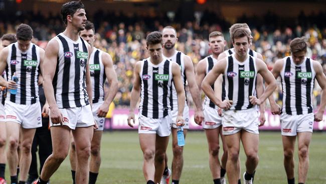 Dejected Collingwood players after the loss to Richmond.