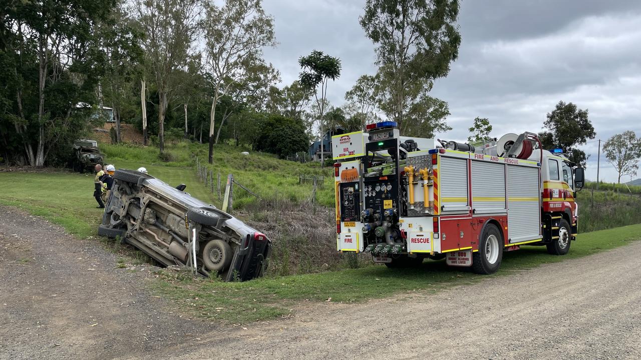 Emergency crews at the scene of a Mackay region rollover on Erinagh Rd in Balnagowan. Photo: Fergus Gregg