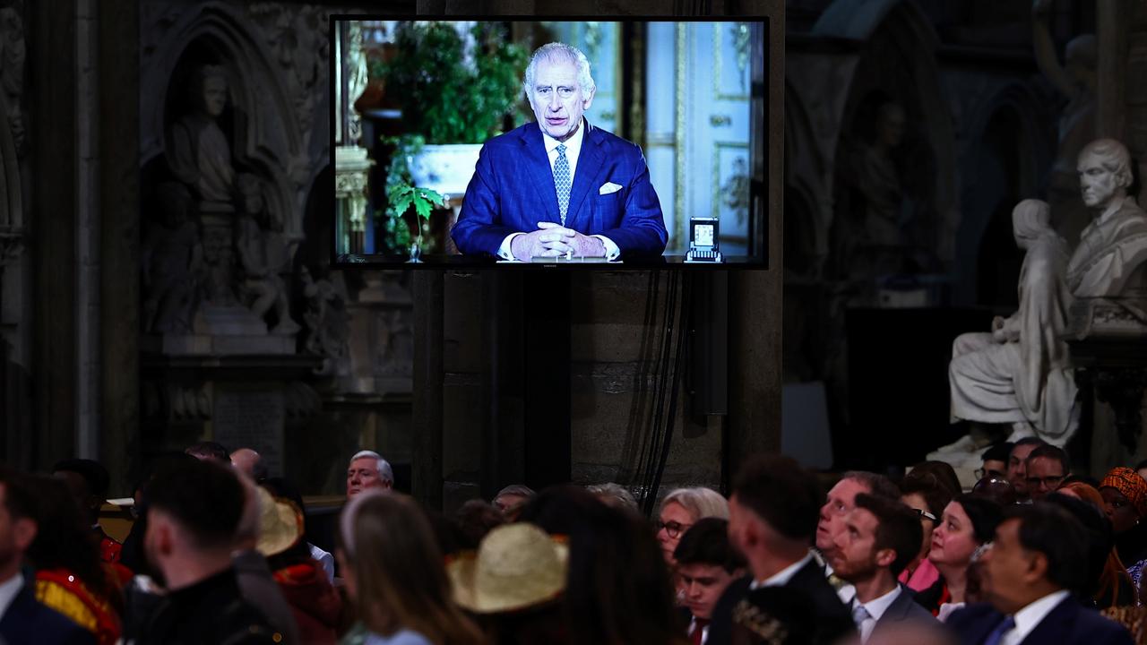 Guests watch a video of King Charles III delivering a message during the 2024 Commonwealth Day Service at Westminster Abbey. Picture: Henry Nicholls - WPA Pool/Getty Images