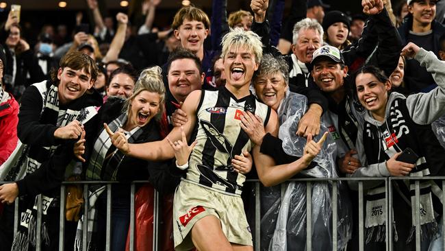 Jack Ginnivan celebrates with the Magpies fans. Photo by Daniel Carson/AFL Photos via Getty Images