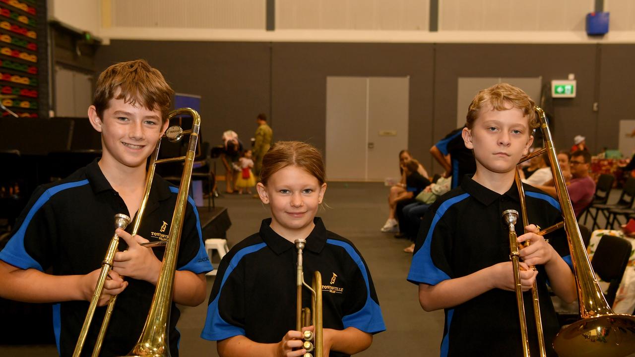 Defence 2024 Welcome and Information Expo at Townsville Stadium. Rowan Franklin, 11, Darby Larsen, 10, and Thomas Winstanley, 12, from Townsville Brass. Picture: Evan Morgan