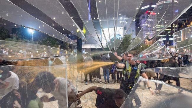 Police spray crowds with pepper spray to end a massive brawl at Federation Square during Moomba festivities. Picture: Jake Nowakowski