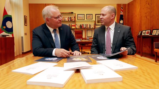 Scott Morrison, left, with Josh Frydenberg, who has warned of ‘substantial uncertainty’ about the budget assumptions on the impact of coronavirus and the possibility of a vaccine Picture: Adam Taylor