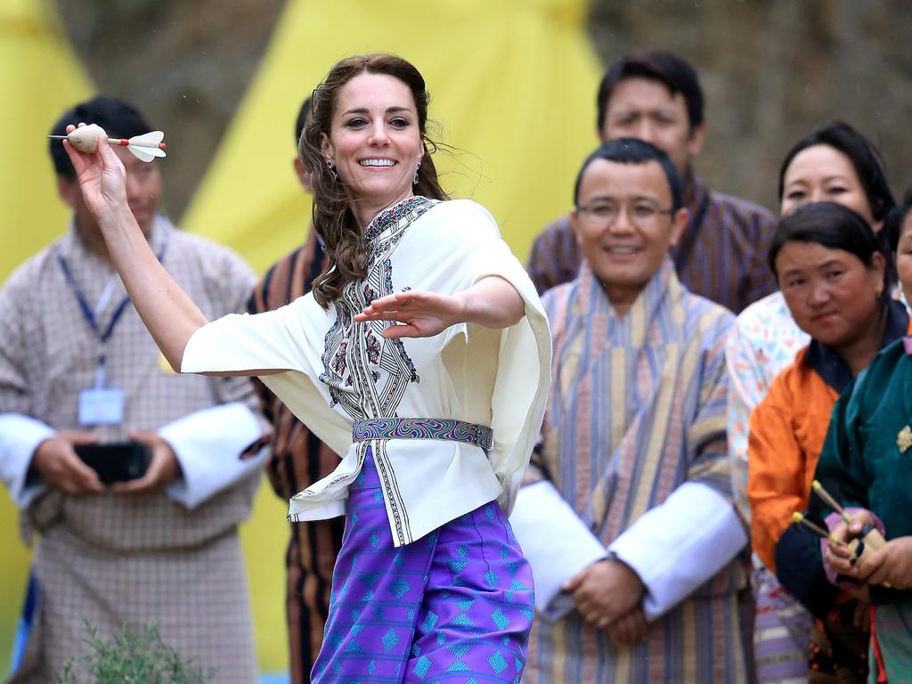 Catherine, Duchess of Cambridge throws a dart during a Bhutanese sporting demonstration on the first day of a two day visit to Bhutan on the 14th April 2016 in Paro, Bhutan. Picture: Getty