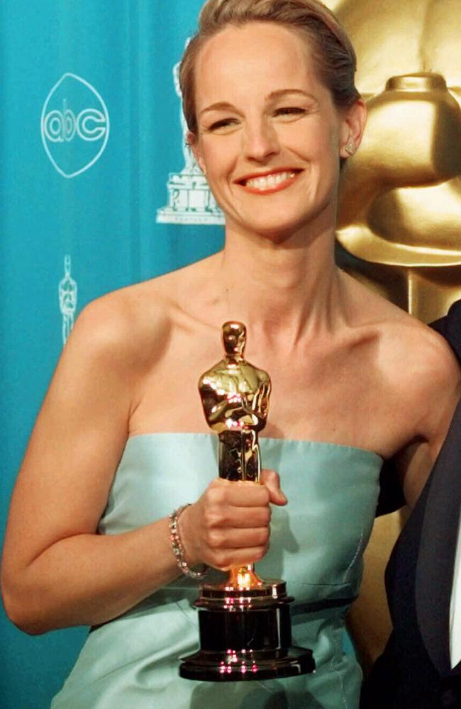 Actor Helen Hunt holding her Oscar trophy after being named Best Actress at the 70th Academy Awards. Picture: AP
