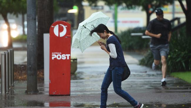 Wet cold weather swept into Darwin on Tuesday leaving residents shivering. Picture: Justin Kennedy