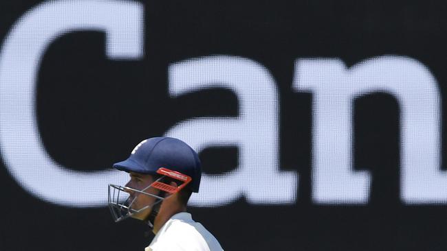 England's Alastair Cook walks from the field. Photo: AAP