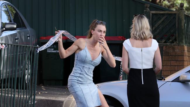 A shocked neighbour outside the apartment complex today. Picture: NCA NewsWire / Dylan Coker