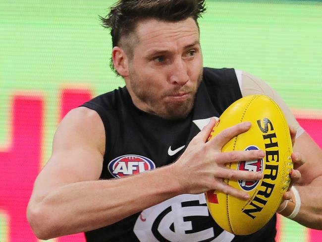 AFL Round 23. 24/08/2019.  Geelong v Carlton at GMHBA Stadium, Geelong.  Dale Thomas of the Blues tackled over the boundary line by Geelongs Luke Dahlhaus   . Pic: Michael Klein