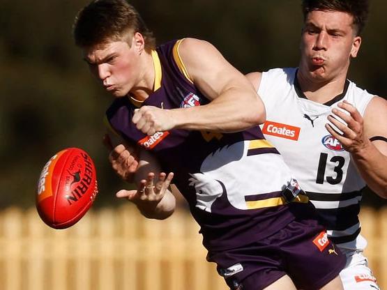 MELBOURNE, AUSTRALIA - SEPTEMBER 03: Joshua Walker of the Chargers handballs under pressure from Kristian Ferronato of the Knights during the Coates Talent League Boys Wildcard Round match between Northern Knights and Oakleigh Chargers at La Trobe University Sports Fields on September 03, 2023 in Melbourne, Australia. (Photo by Daniel Pockett/AFL Photos/via Getty Images)