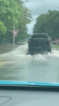 Flash flooding on a Sunshine Coast roundabout