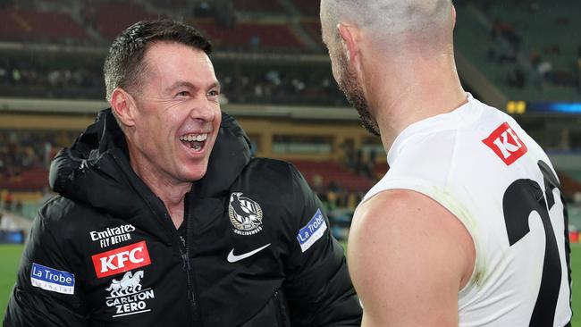 Craig McRae and Steele Sidebottom enjoy a Collingwood win.