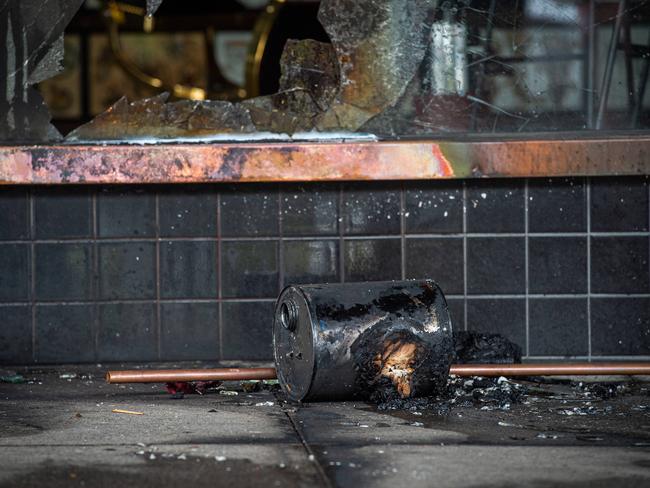 The blaze was sparked when a lit fuel can was thrown at the shopfront. Picture: Jason Edwards