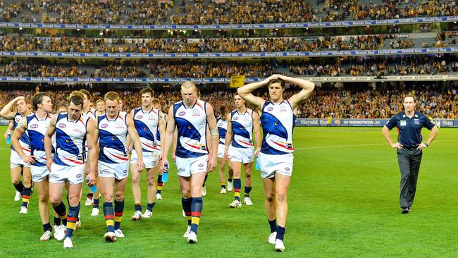 Brenton Sanderson, right, and the Crows after their 2012 preliminary final loss to Hawthorn.