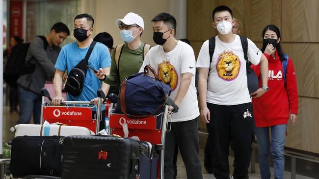 People wearing masks at Sydney Airport this week. Picture: Chris Pavlich