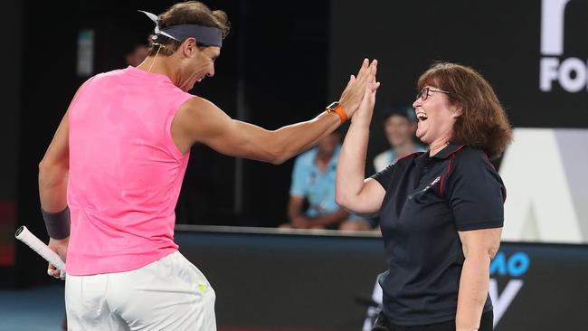 Rafael Nadal high-fives his partner, CFA firefighter Deb Borg. Picture: Michael Klein