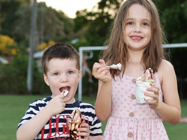 Edward Housley, 4, and Alexandra Housley, 6, enjoy an icecream sundae at the Barron River Food Festival, held at the Stratford Dolphins Football Club. Picture: Brendan Radke