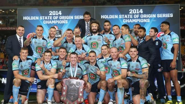 The NSW Blues team of 2014 celebrate their drought-breaking series win.