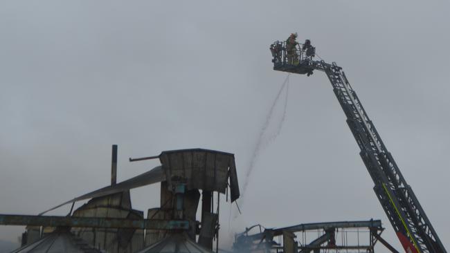 Aerial crews containing the fire at Allora Grain and Milling ,