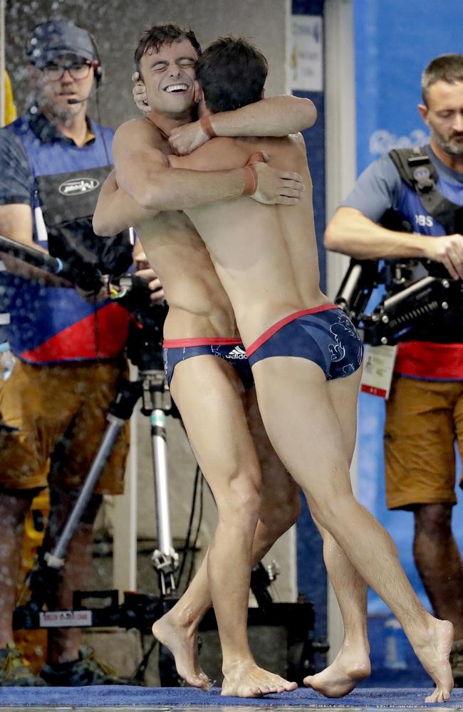 Tom Daley, left, and Daniel Goodfellow where so happy celebrating they fell in the pool Picture: AP Photo/Matt Dunham.