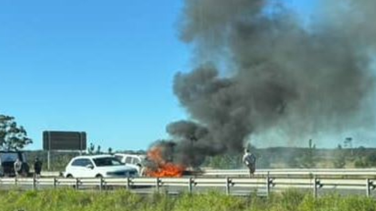 Traffic chaos as car bursts into flames on Bruce Hwy