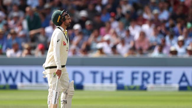 Nathan Lyon limps between wickets during his 25-minute stay at the crease. Picture: Getty