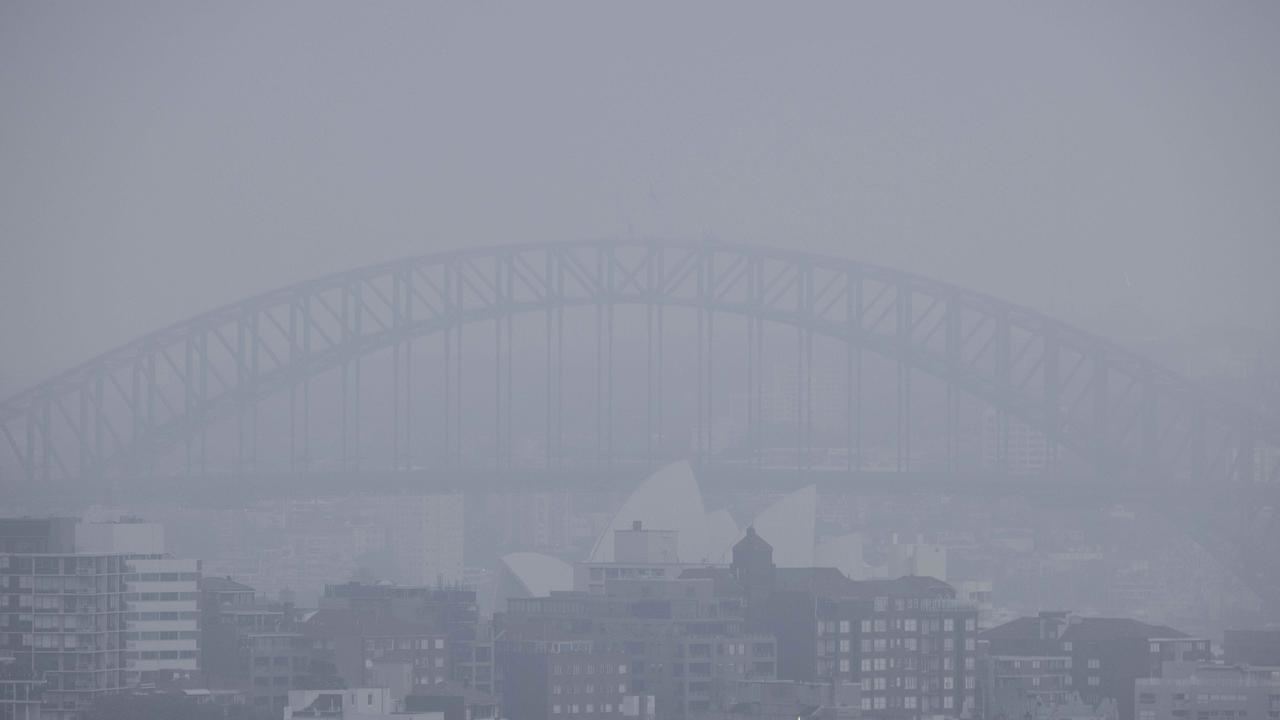 The Sydney Harbour Bridge and Opera House covered by sea fog on Sunday morning. Picture: NCA NewsWire/Jenny Evans