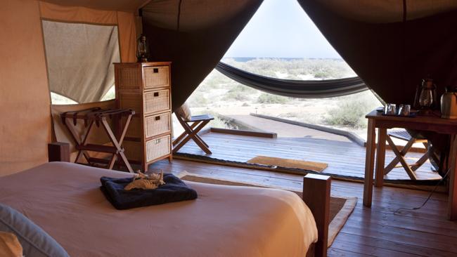 The view out across the dunes from within a luxury Sal Salis tent at Ningaloo Reef.Picture: James Morgan 