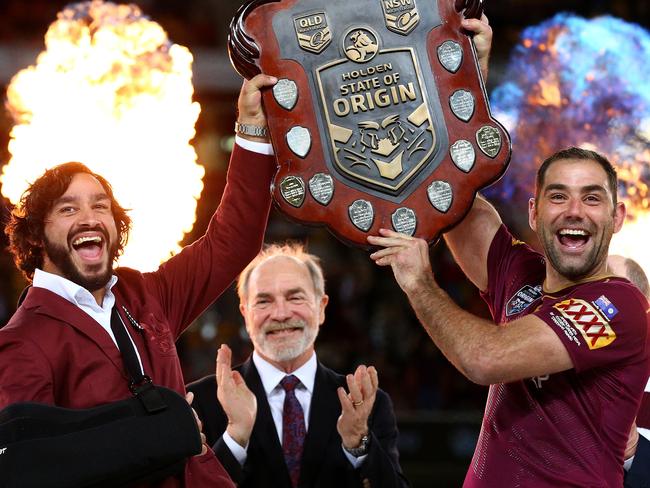 Johnathan Thurston and Cameron Smith hold the shield up to celebrate winning the Origin decider between Queensland and NSW at Suncorp Stadium in Brisbane. Pics Adam Head