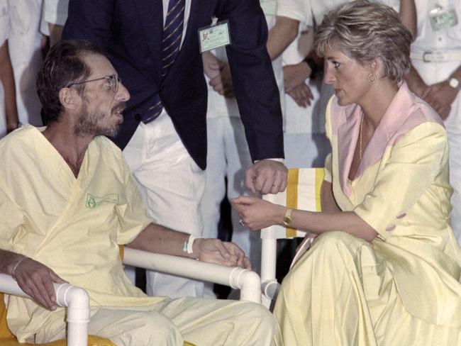 Diana sits with a man diagnosed with AIDS in Rio de Janeiro. Picture: Carlos Santana