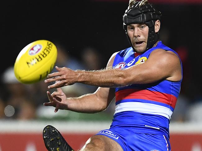 MACKAY, AUSTRALIA - MARCH 03: Caleb Daniel of the Bulldogs kicks the ball during the 2019 JLT Community Series AFL match between the Gold Coast Suns and the Western Bulldogs at Great Barrier Reef Arena on March 03, 2019 in Mackay, Australia. (Photo by Ian Hitchcock/Getty Images)