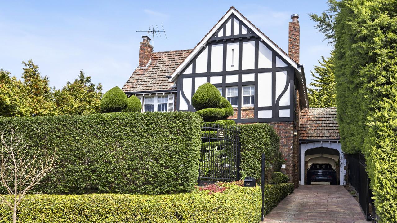 A front garden hedge provides privacy.