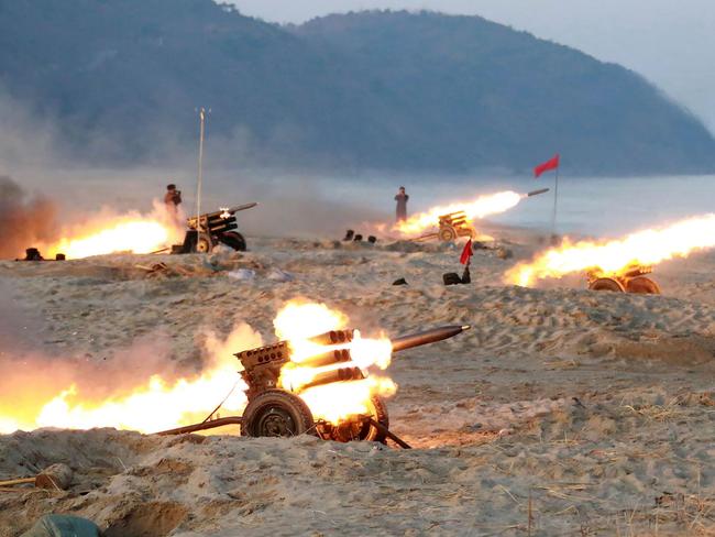 This undated picture released from North Korea's official Korean Central News Agency (KCNA) on December 21, 2016 shows a firing contest among multiple launch rocket system (MLRS) batteries selected from large combined units of the KPA at an undisclosed location in North Korea. / AFP PHOTO / KCNA / KNS / - South Korea OUT / REPUBLIC OF KOREA OUT ---EDITORS NOTE--- RESTRICTED TO EDITORIAL USE - MANDATORY CREDIT 