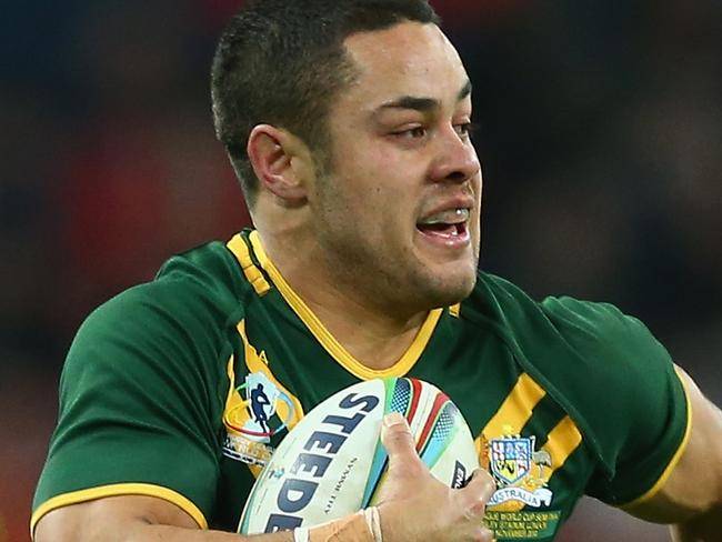 LONDON, ENGLAND - NOVEMBER 23: Jarryd Hayne (C) of Australia bursts past Sisa Ledua Waqa (L) and Tariq Sims (R) of Fiji on his way to scoring a try during the Rugby League World Cup Semi Final match between Australia and Fiji at Wembley Stadium on November 23, 2013 in London, England. (Photo by Michael Steele/Getty Images)