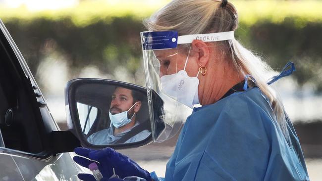 People lining up to be tested at the Covid Testing centre in the Outback Spectacular carpark at Oxenford. Frontline health workers will get parking fee relief. Picture Glenn Hampson.