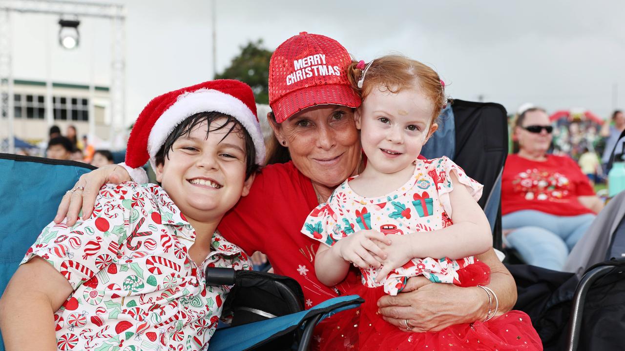 Gareth Furze, 10, Catherine Mamley and Bronte Furze, 3, at the Cairns Churches Joy to the World Community Carols, held at the Cairns Showgrounds. Picture: Brendan Radke