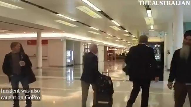 Nine chair Peter Costello has been captured on camera knocking a journalist to the ground during a scuffle at Canberra Airport. Picture: The Australian