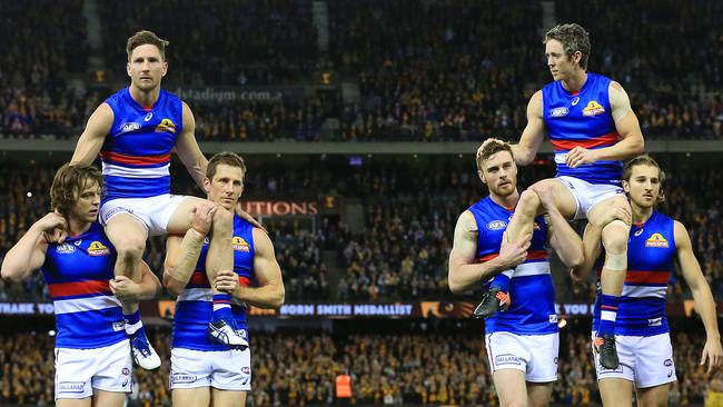 Matthew Boyd and Robert Murphy are chaired off. Picture: Mark Stewart