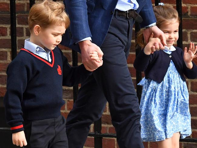 Charlotte, 2, smiled and waved to the cameras, while Prince George looked more pensive. Picture: AFP Photo / Ben Stansall