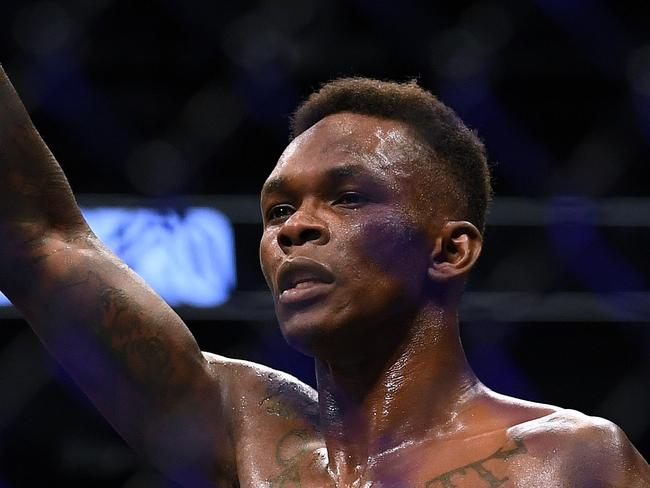 LAS VEGAS, NEVADA - MARCH 07: Israel Adesanya celebrates a decision win over Yoel Romero during a middleweight title bout at T-Mobile Arena on March 07, 2020 in Las Vegas, Nevada.   Harry How/Getty Images/AFP == FOR NEWSPAPERS, INTERNET, TELCOS & TELEVISION USE ONLY ==