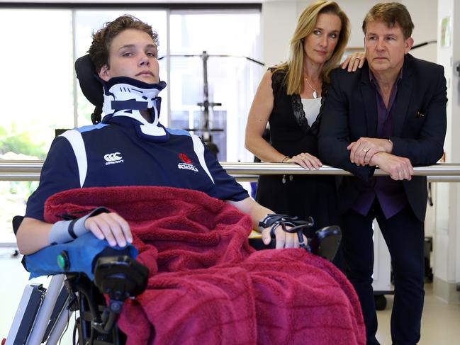 Alex Noble with his parents Kylie and Glen at the Ryde pictured at the Rehab Hospital in Putney where is recovering after breaking his neck in a horrific rugby accident. Mum Kylie and dad Glen in the rear. Pic, Sam Ruttyn