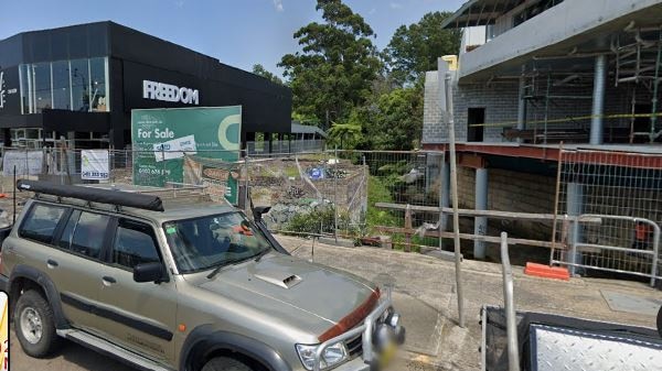 A site of a proposed 39-room boarding house at Manly Vale is between Freedom Furniture and a block of apartments. Picture: Google Maps