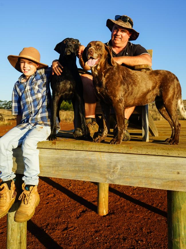Lewis Walter, 9, with dad Rob Walter at their Strathkellar farm dam, which is mostly dry. Picture: Rachel Simmonds