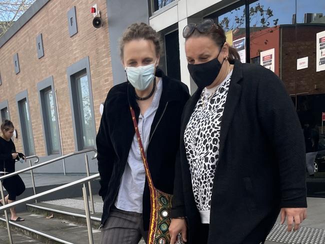 Megan Victoria Jeffrey (left) leaving Wyong Local Court with a support person after she was sentenced for stealing morphine. Picture: NewsLocal